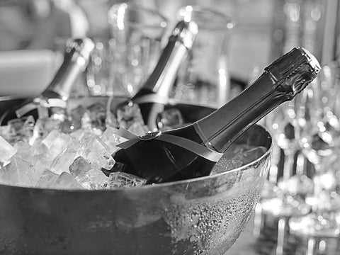 Champagne bottles and crystal coupe glasses for a toast