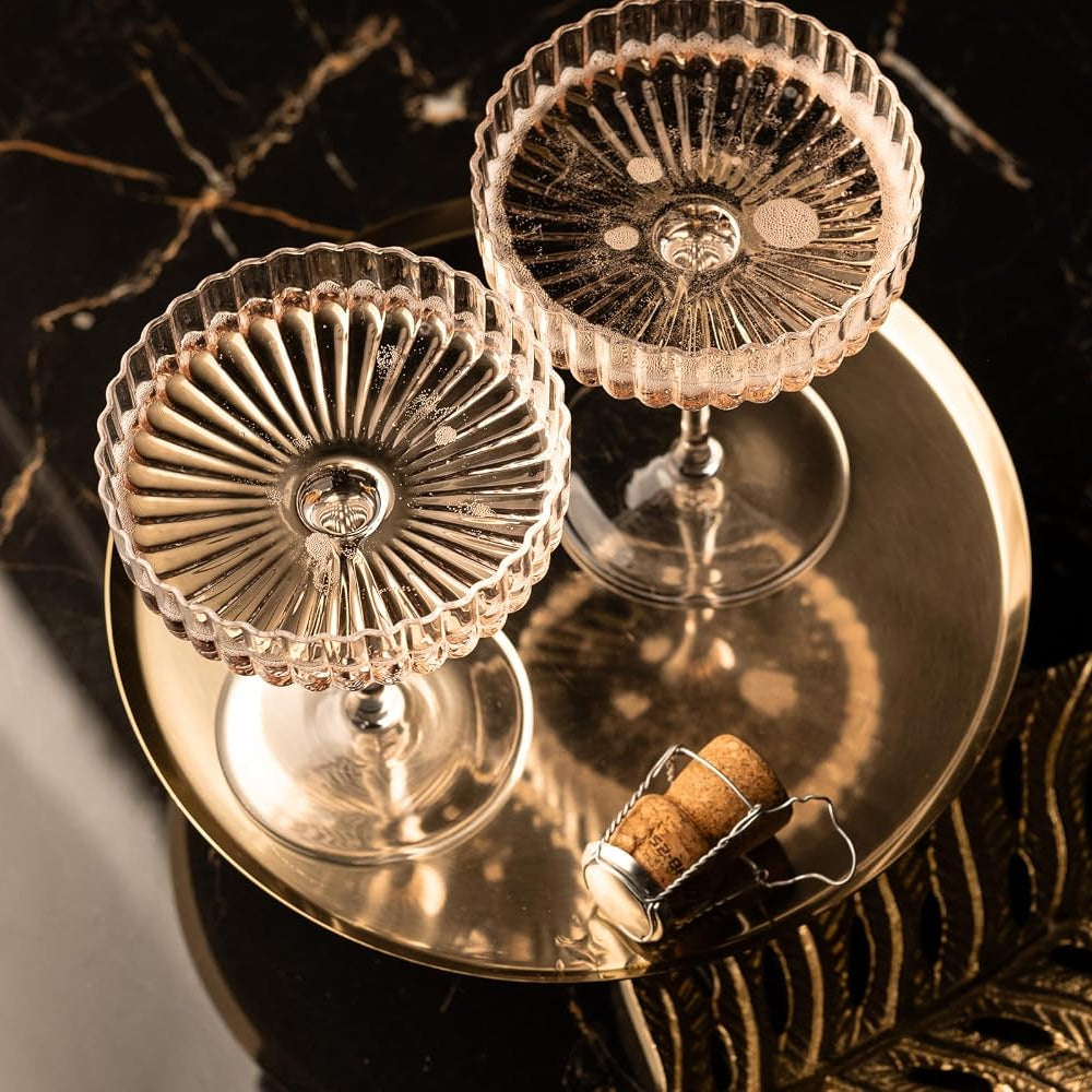 Venus Seashell Coupetini Cocktail Glasses Set of 4 – top view of two glasses on a gold tray with a cork